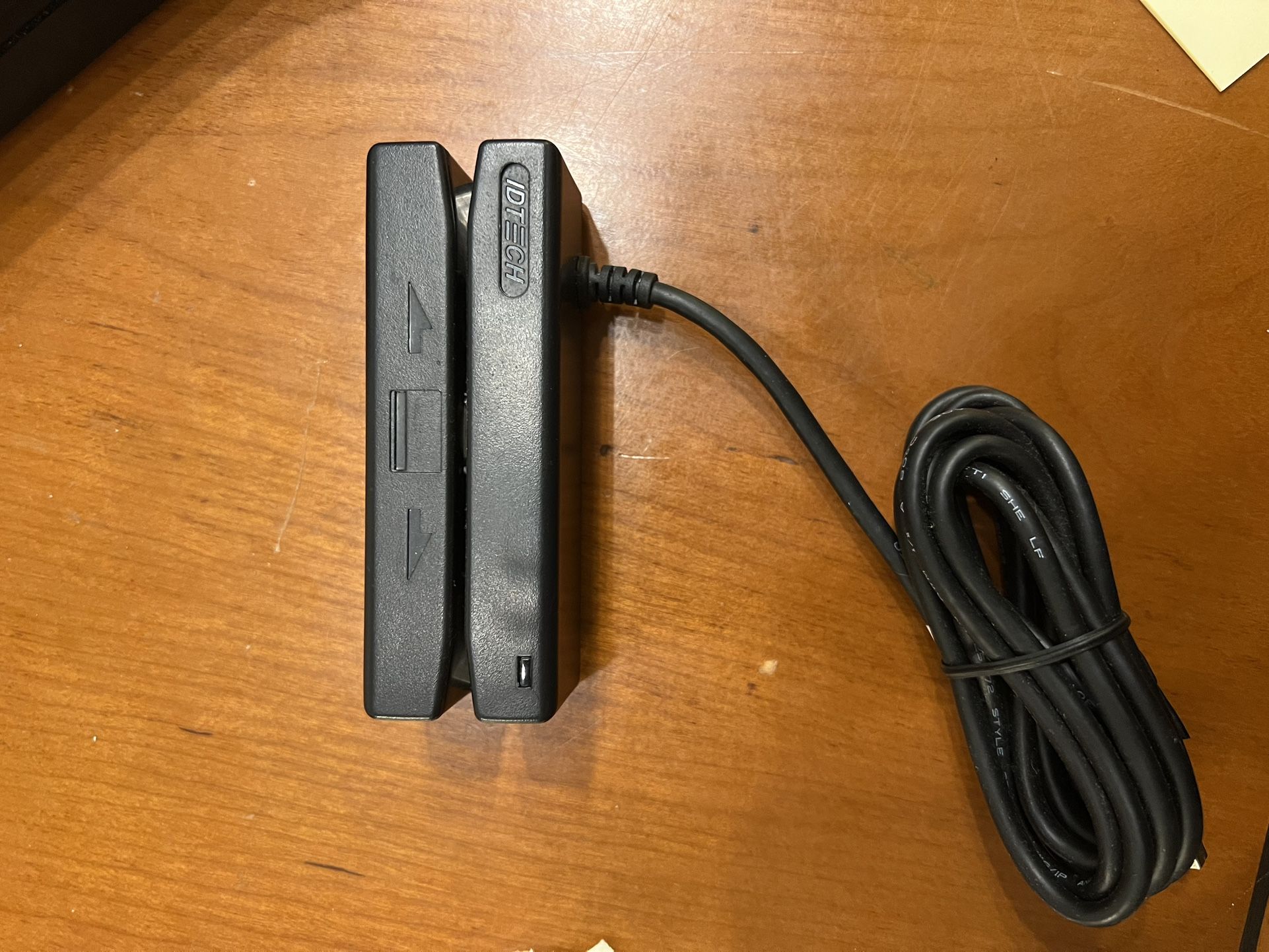 ID TECH MiniMag II magnetic stripe reader. This device is used to read data from the magnetic stripes on credit cards or other similar cards.