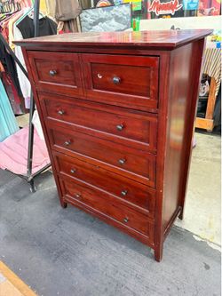 Sturdy wooden tallboy dresser with a cherry finish