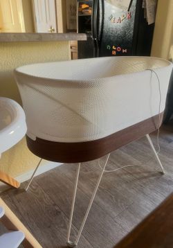 Snoo bassinet and several swaddles