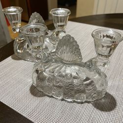 Beautiful set of 2 vintage crystal glass candelabras. Each holds 4 candles and features an elegant cut-glass design with a classic, timeless look. Per