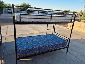 Metal twin Size bunk bed with mattress in good condition $180