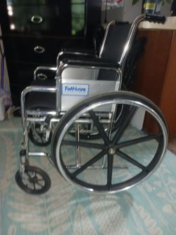 Sturdy and well taken care of wheelchair with petals.