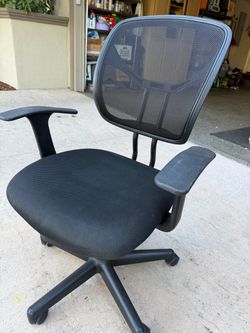 Black office chair with armrest.
