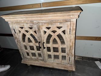 Distressed Wood Cabinet with Carved Doors
