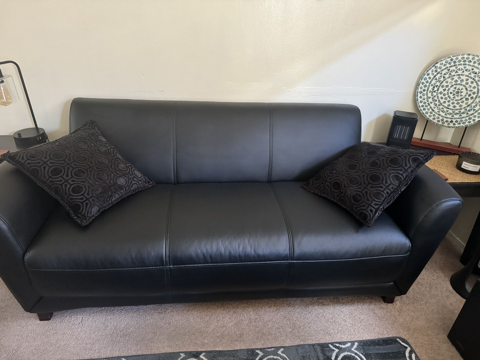 Black leather couch, perfect condition