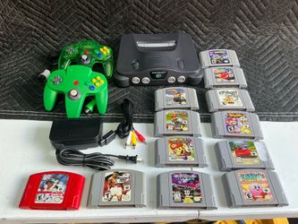 Nintendo 64 console with remote controls and 12 games