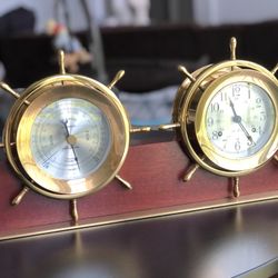 AMERICAN BRASS 'HELMSMAN' SHIP'S WHEEL CLOCK AND BAROMETER, SETH THOMAS CLOCK CO., THOMASTON, CONNECTICUT.