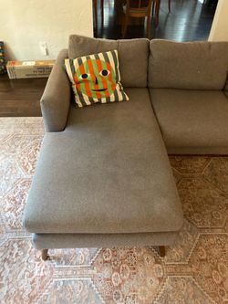 Gray midcentury sofa with chaise lounge