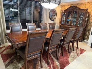Unique Solid Wood Dining Room Table, 8 leather chairs & buffet