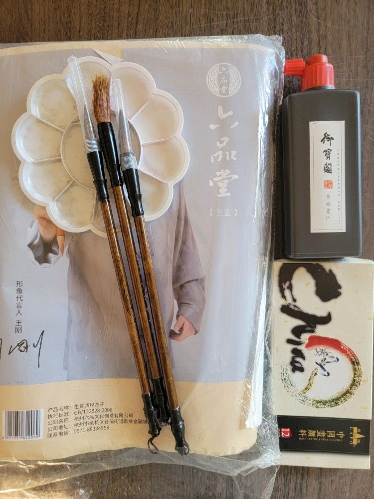 Raw xuan paper, Chinese calligraphy brushes, paints, and ink