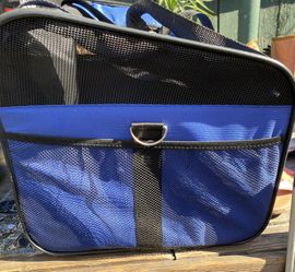 Great Condition. Small animal carrier w/side pockets n openings