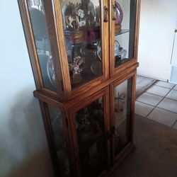 Glass Display Case with carousel miniatures.