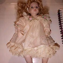 Antique Porcelain Sitting Doll In Pink Dress