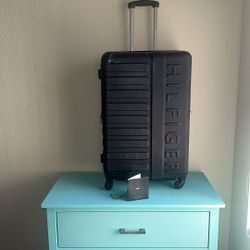 LUGGAGE by Tommy Hilfiger  - 28” by 19” hard-sided spinner suitcase Used In Good Condition.
