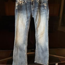 Vigoss bootcut jeans, specifically from "The Chelsea" line. These jeans feature heavy contrast stitching and intricate embroidery with rhinestone embe