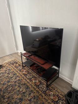 Tv and tv stand with Roku