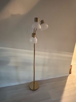 Gold three bulb standing lamp