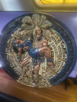 “Mujer en Brazos de Azteca “