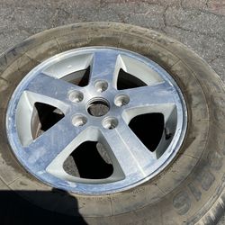 One Dodge Caravan 16 inch aluminum rim. 5 on 127mm fits Chrysler 