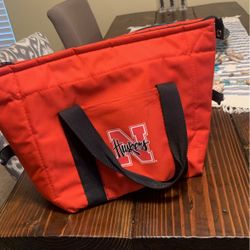 Husker cooler: Holds About 8 Cans 