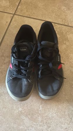 Boy shows adidas size 3