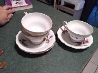 Gold rimmed tea cups and plates
