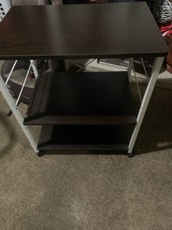 Small shelves for storage has wheels and locks on wheels
