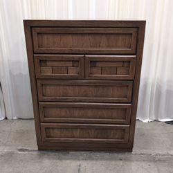 Honey Wood Five-Drawer Dresser with Geometric Top Panels