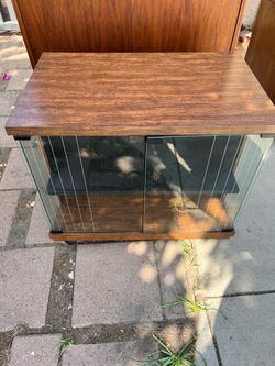 Mid-Century style rolling media cabinet / audio rack with glass doors.