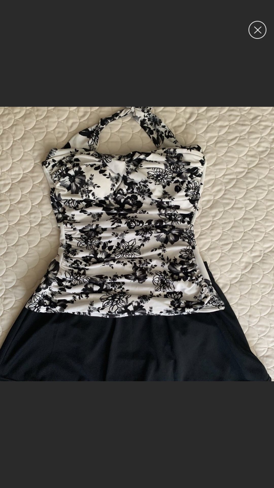 Two piece suit flowery white with black flowers very flattering by Catalina namebrand suddenly slim size medium New Like Condition