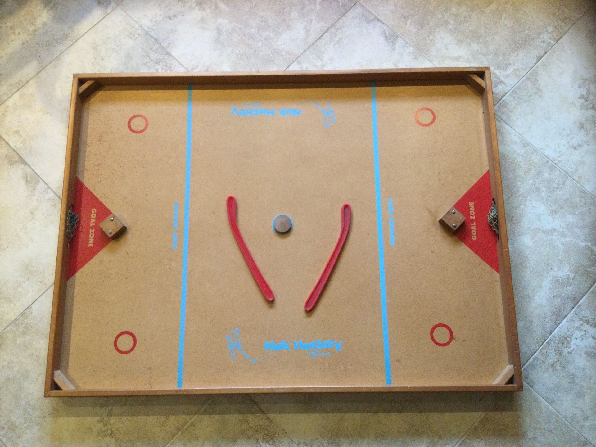 Nok Hockey Board with Two Sticks and a Puck