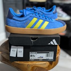 New 
Size 8.5 Men's 
Adidas VL Court 3.0 sneaker 
Blue With Yellow Stripes 
JP5286