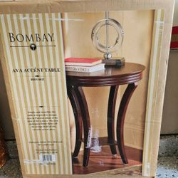 Bombay Ava Accent Table mohagany color.

22" diameter, 26" Height 