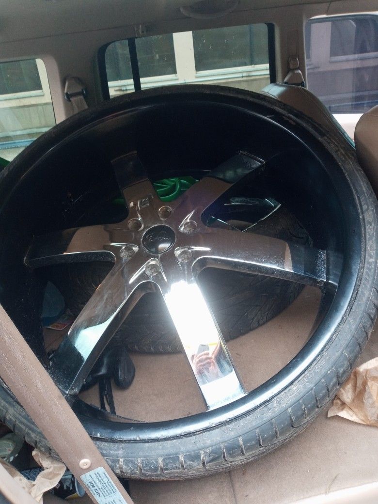 4. 28" Rims.   1 Tire Busted