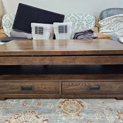 Great shape and sturdy real wood lift table with storage.