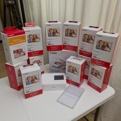 Canon Selphy CP1500 photo printer with 12 packs of of paper and ink