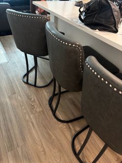 Grey studded barstools