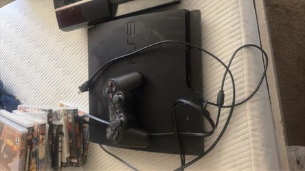 PlayStation 3 Slim (used but works perfectly) with games