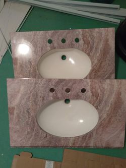 2 like new sinks tops. 30x19