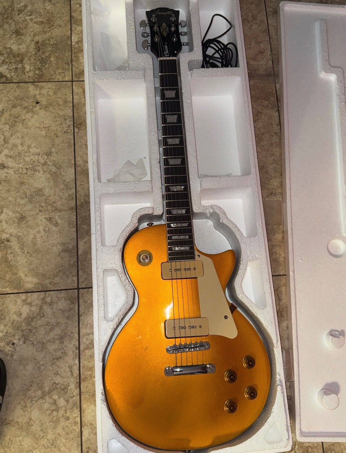 Firefly electric guitar, with an amp