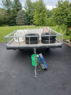 8x8 utility tilting trailer with tailgate and railings new tires comes with Jack stand