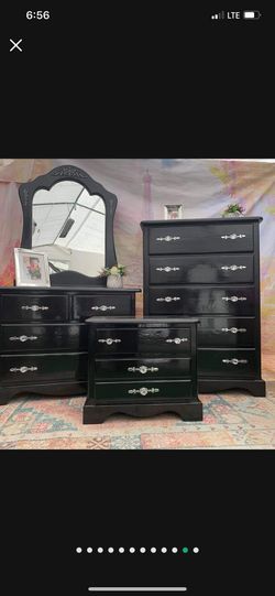 Four pieces wooden dresser set Including two dressers ,mirror and nightstand Set Has been refurbished colors black and silver
