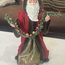 Clothtique Possible Dreams Santa figurine with fabric clothing.