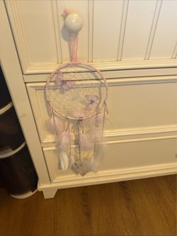 Handcrafted Dreamcatcher Wall Hanging with Pastel Feathers and Beads with a flash