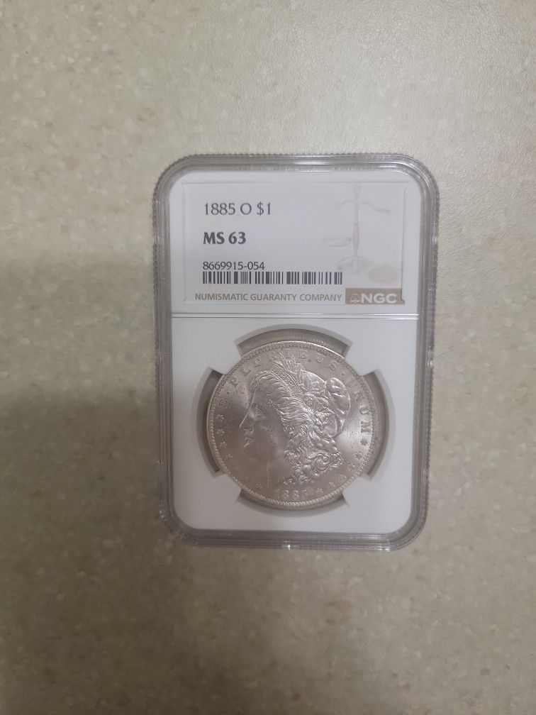 1885 O Morgan Silver Dollar.  Graded 