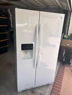 side-by-side refrigerator with water/ice dispenser.