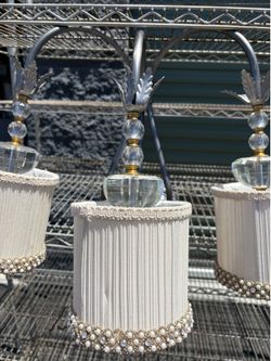 A vintage set of 2 desk lamps  and a wall lamp with 3 lamps.