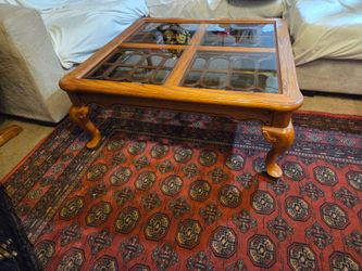 French provincial style wooden coffee table with 4 glass inserts, one small Crack in the corner of 1