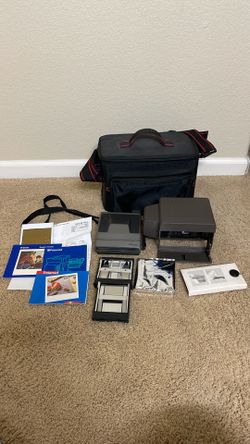Polaroid 1200si Instant Film Camera, light lock lens, manuals and carrying case