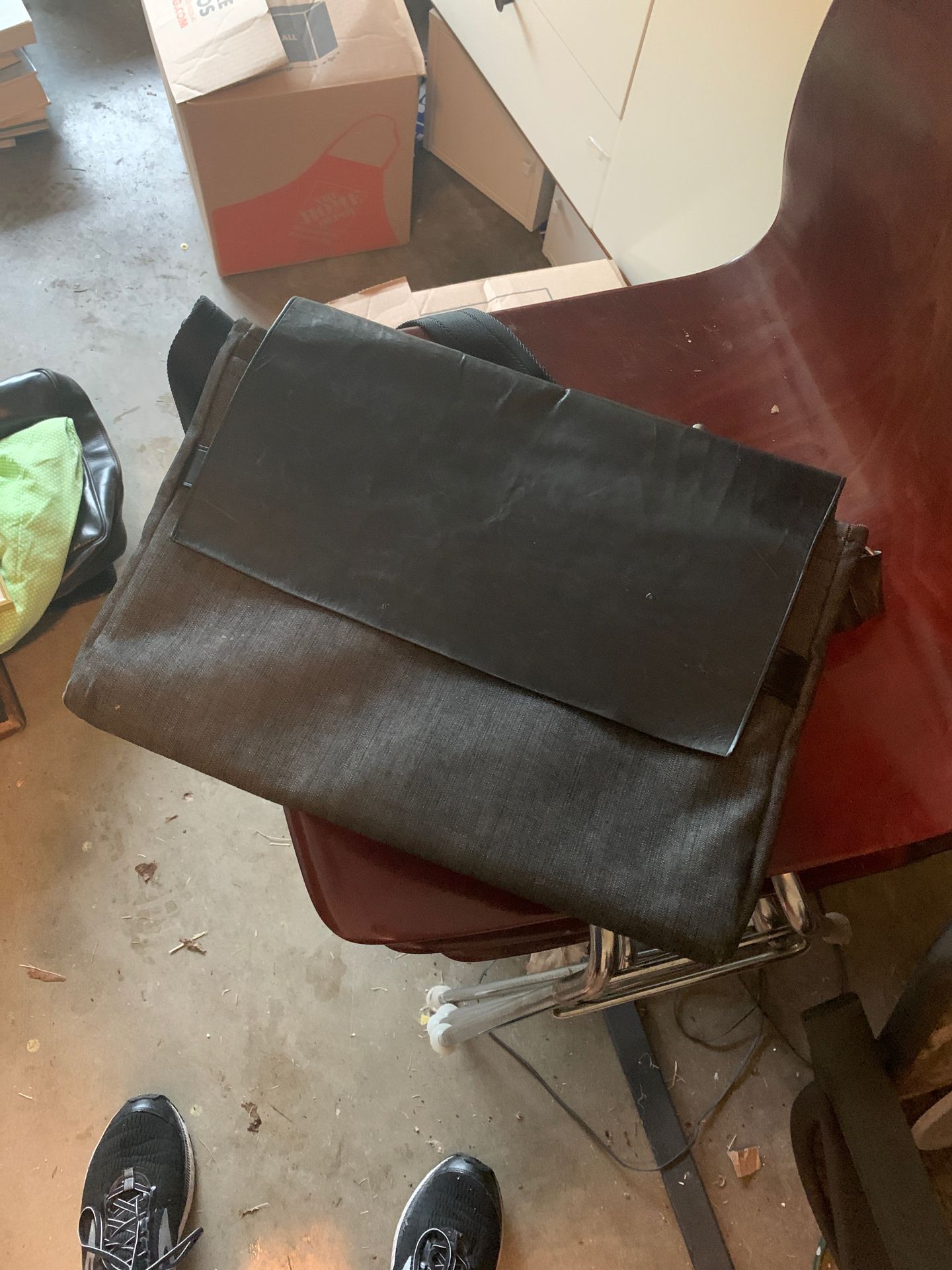 Leather and denim messenger bag
